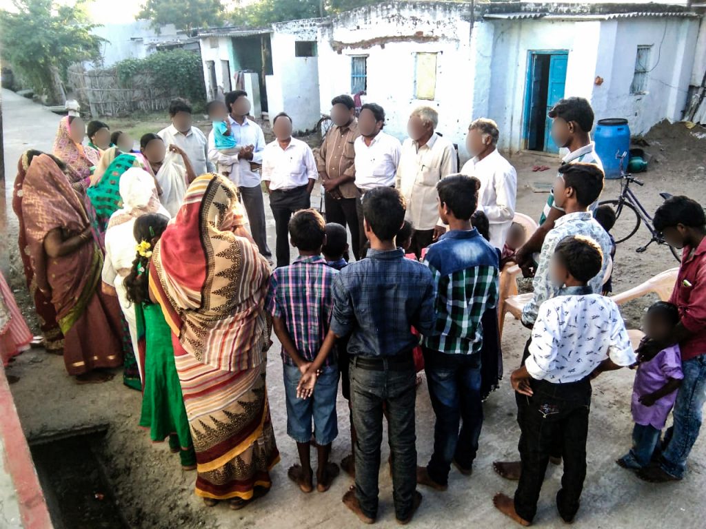 Christian missionary shares the gospel with villagers in India