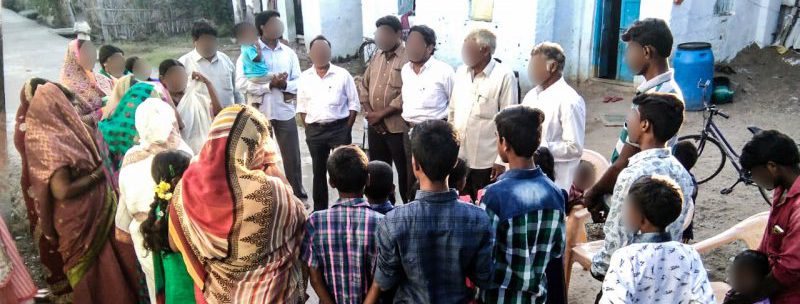 Christian missionary shares the gospel with villagers in India