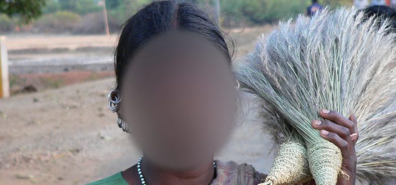 Idian woman holding crops