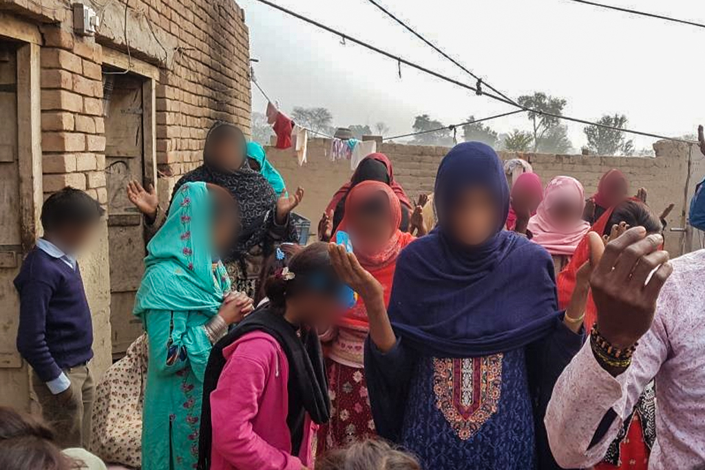 Pakistani christians raise hands and worship God together