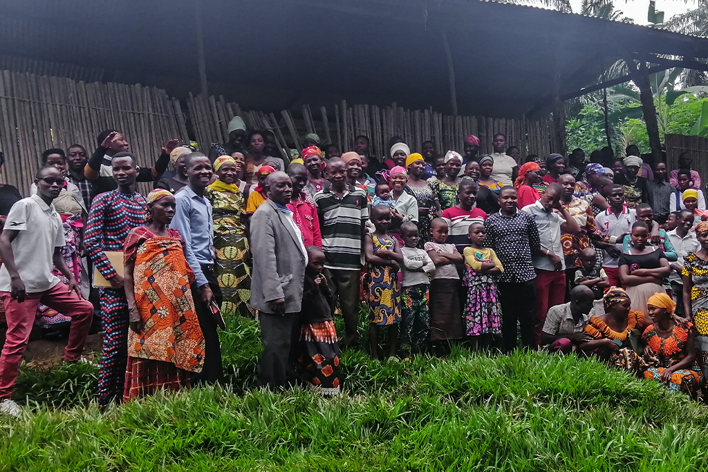 Burundian Christians stand in a group outside of their church