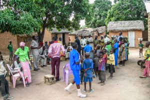 Cameroonian Christians gathering together for church in the middle of their village