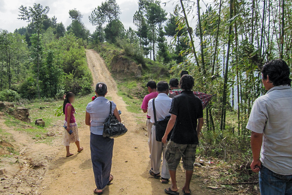 Nepalese Christians walking down a dirt road