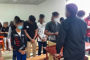 Sri Lankan Christians led in prayer by Christian missionary in classroom