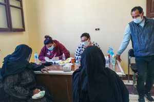 African women checking into a health clinic