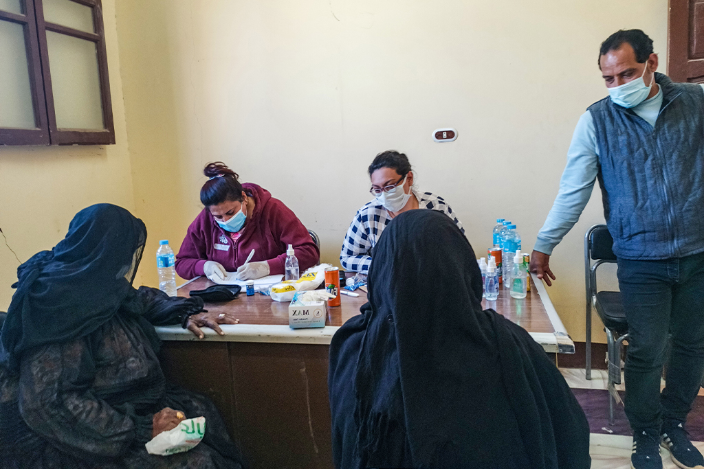 African women checking into a health clinic