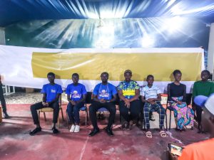 Gambian Christian students sit in a row in chairs