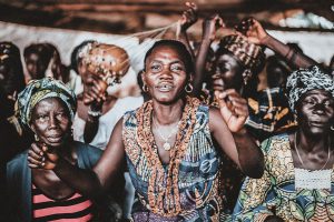 African Christian women dancing and singing while worshiping God