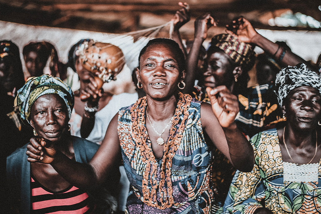 African Christian women dancing and singing while worshiping God