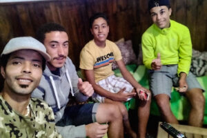 Muslim refugees playing UNO with Spanish teenagers