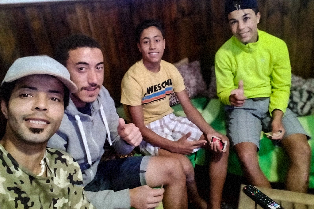 Muslim refugees playing UNO with Spanish teenagers