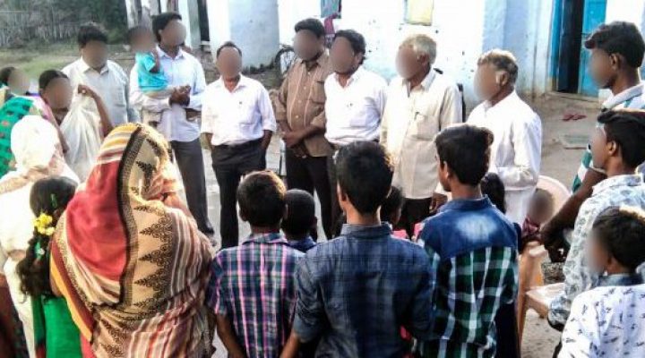 Christian missionary shares the gospel with villagers in India