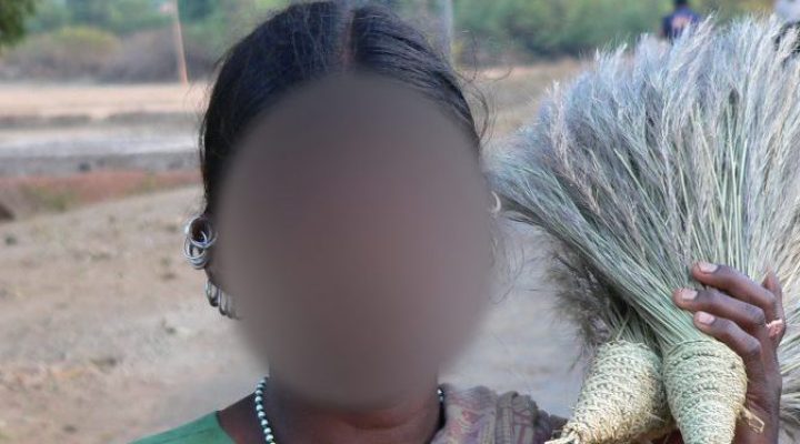 Idian woman holding crops