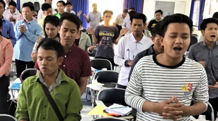Lao Christians sing praises to God and worship God in their church