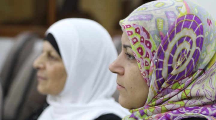 Two Syrian women with head coverings on
