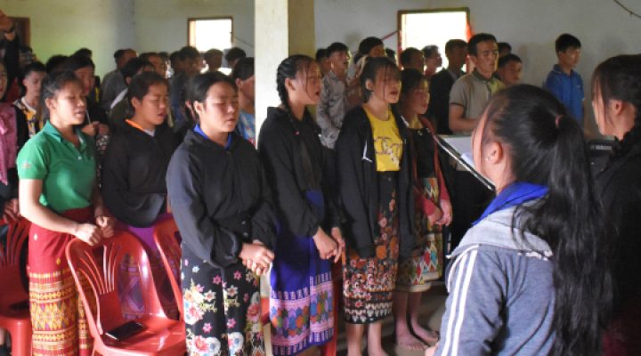 Christian youth and young adults in Laos gather in their local church to sing to God